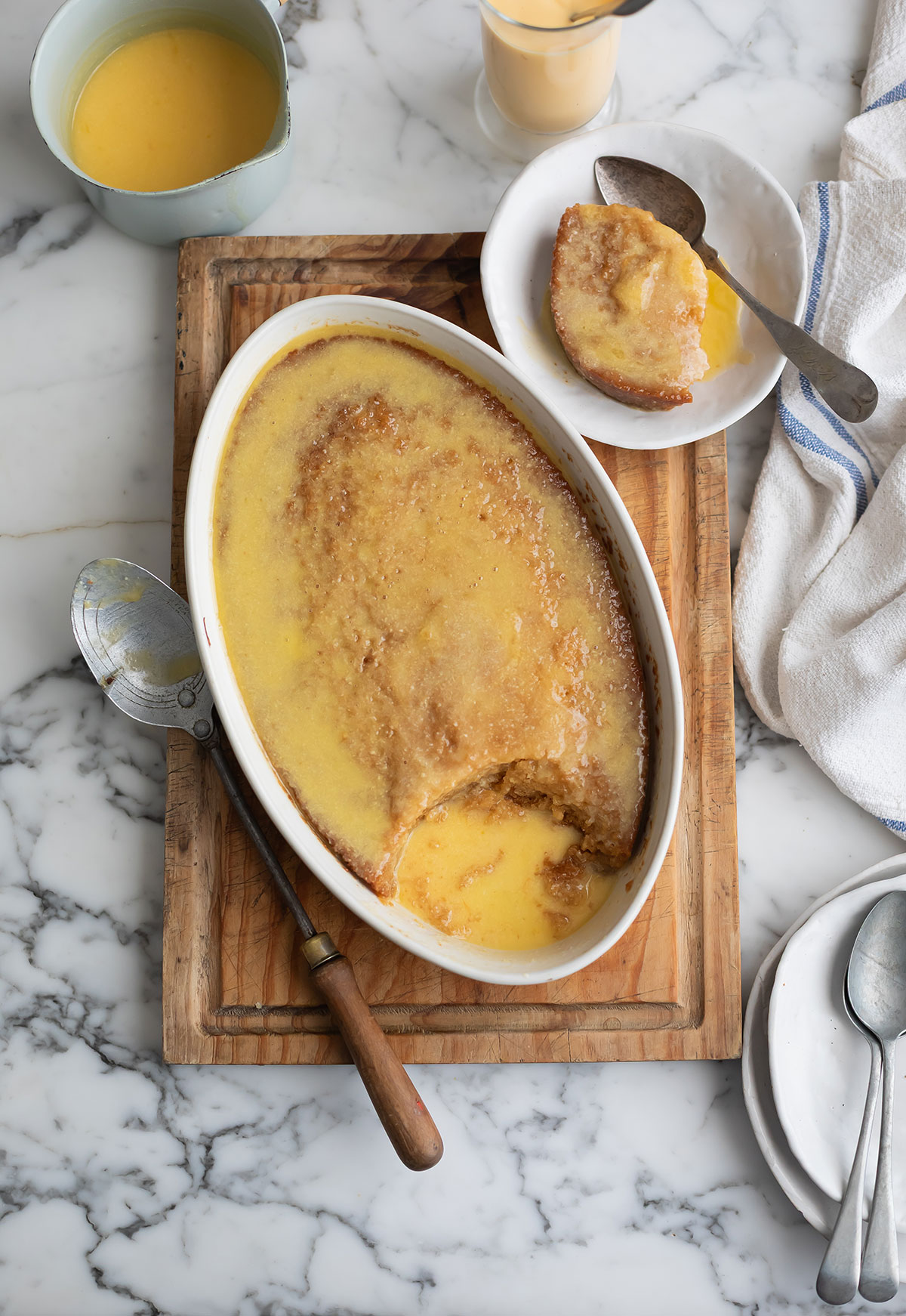 Orange Malva Pudding Recipe in a dish on a board