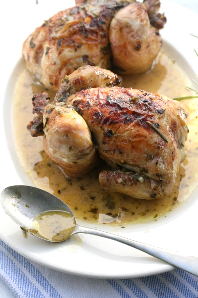 Roast baby chicken with white wine, herbs and garlic recipe