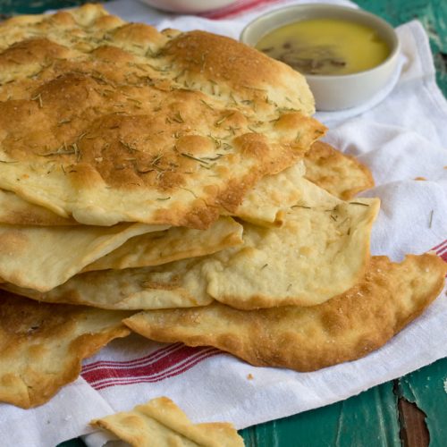 A pile of the best ever crispy flatbreads with salt and rosemary