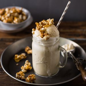 cereal milk milkshake with caramel corn and cornflake clusters