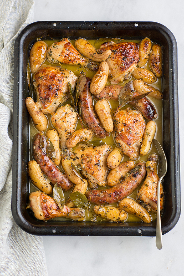Roast chicken and Italian sausage with herbs and orange