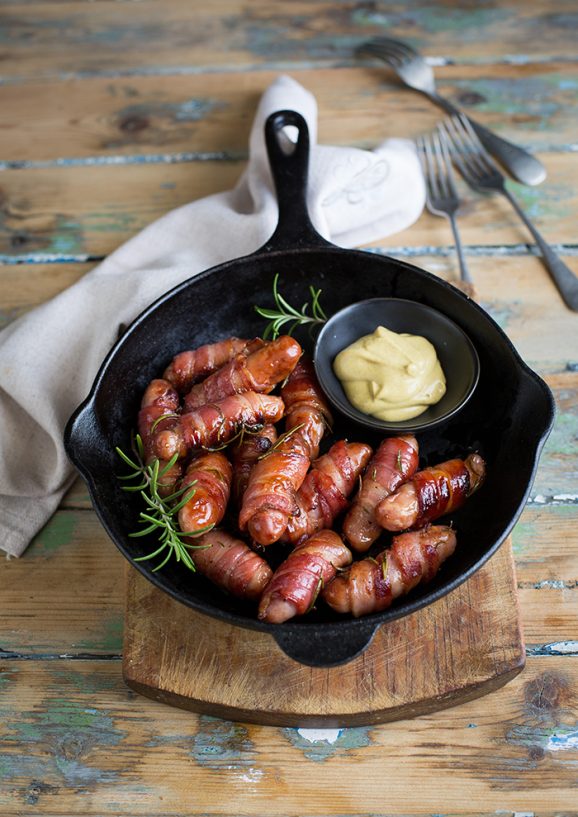 Bacon wrapped sausages with rosemary and honey
