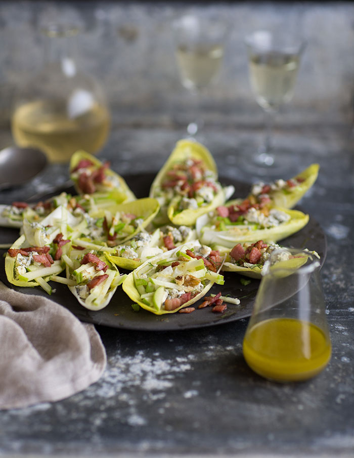 endive salad boats with apple, blue cheese, bacon and walnuts with a maple vinaigrette dressing