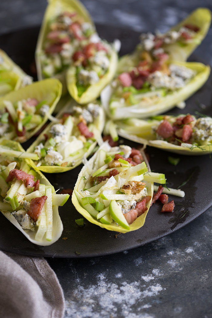 endive salad boats with apple, blue cheese, bacon and walnuts with a maple vinaigrette dressing