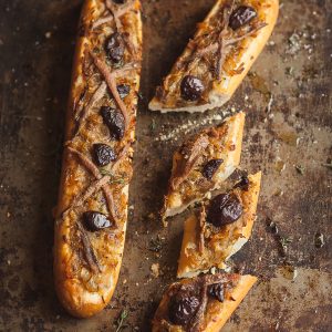 A cheats pissaladiere on baguette