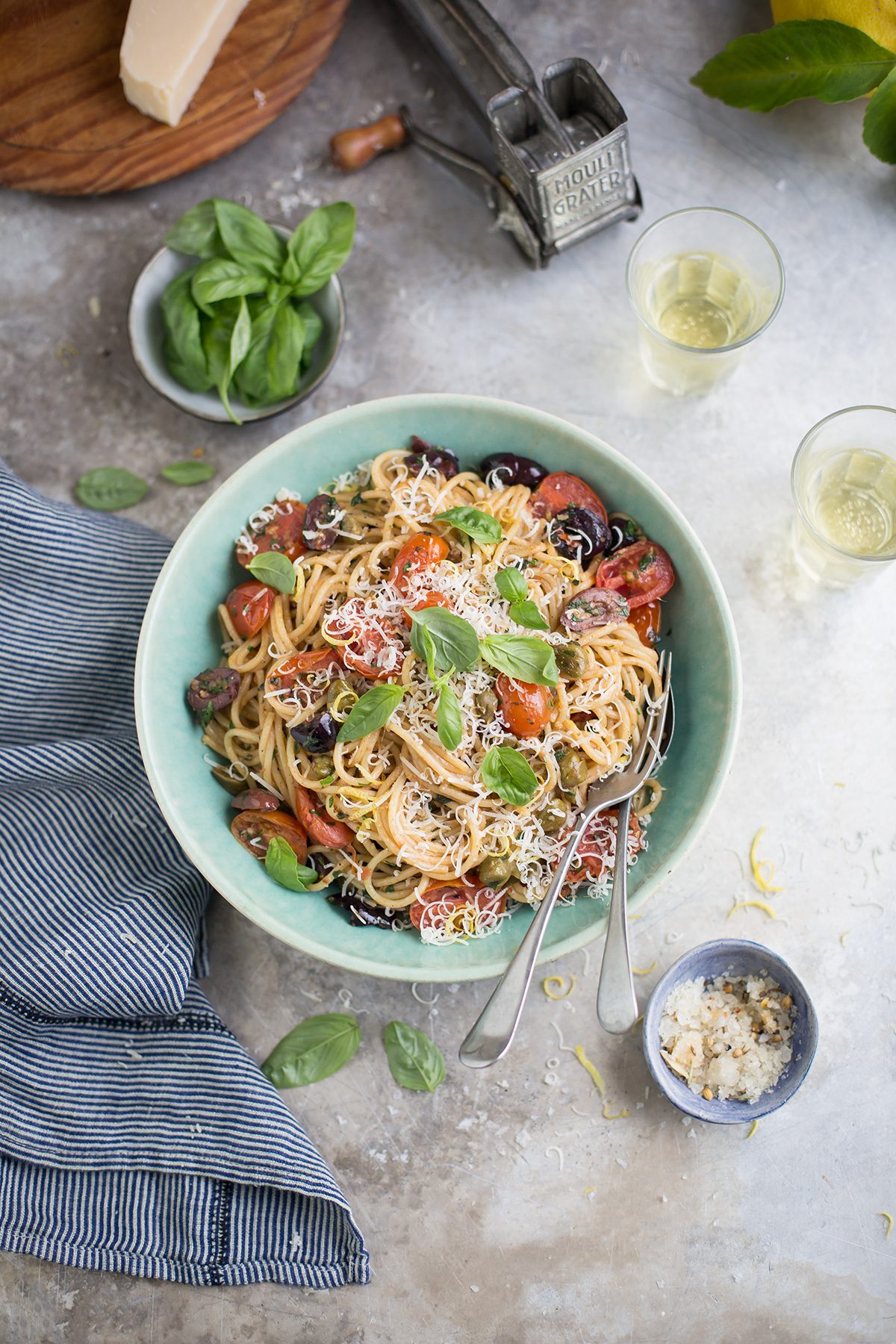A recipe for a delicious summer pasta with tomato, olives, anchovy, basil & lemon