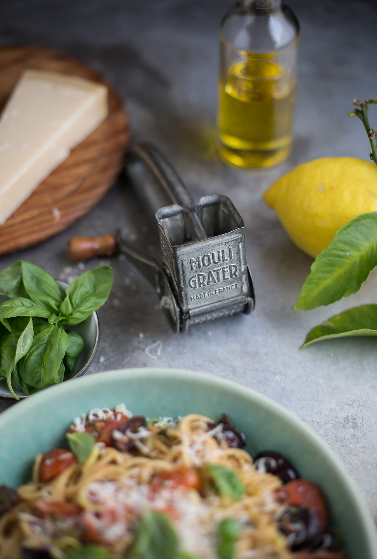A recipe for a delicious summer pasta with tomato, olives, anchovy, basil & lemon