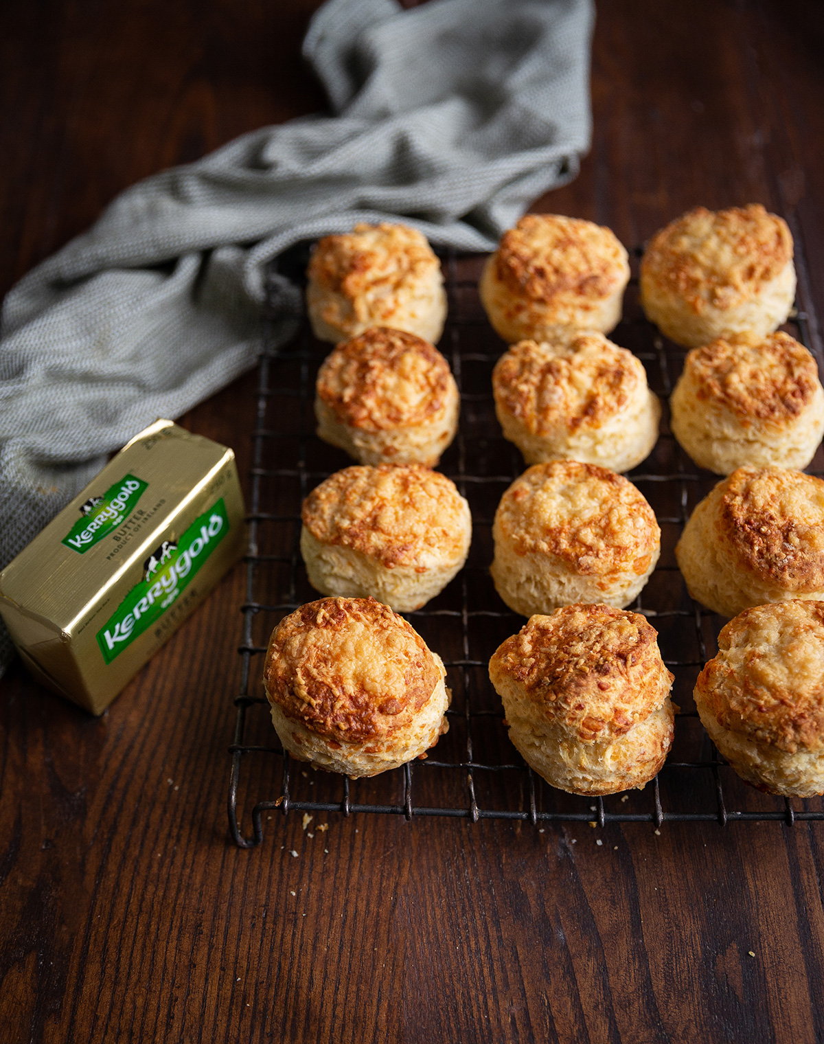 my best cheese scones with butter • Drizzle and Dip Cheese scones cooling on a rack