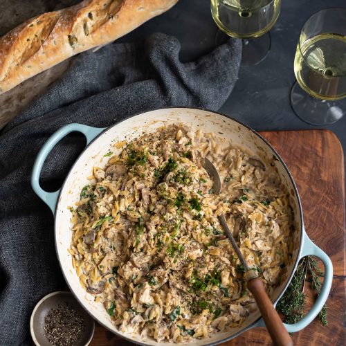 Creamy one-pan orzo with chicken, mushroom & spinach with a spoon