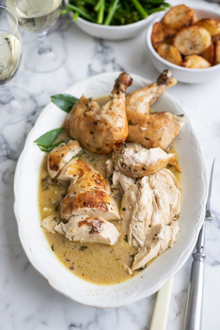 Cut up pieces of the best roast chicken with wine, herbs and garlic