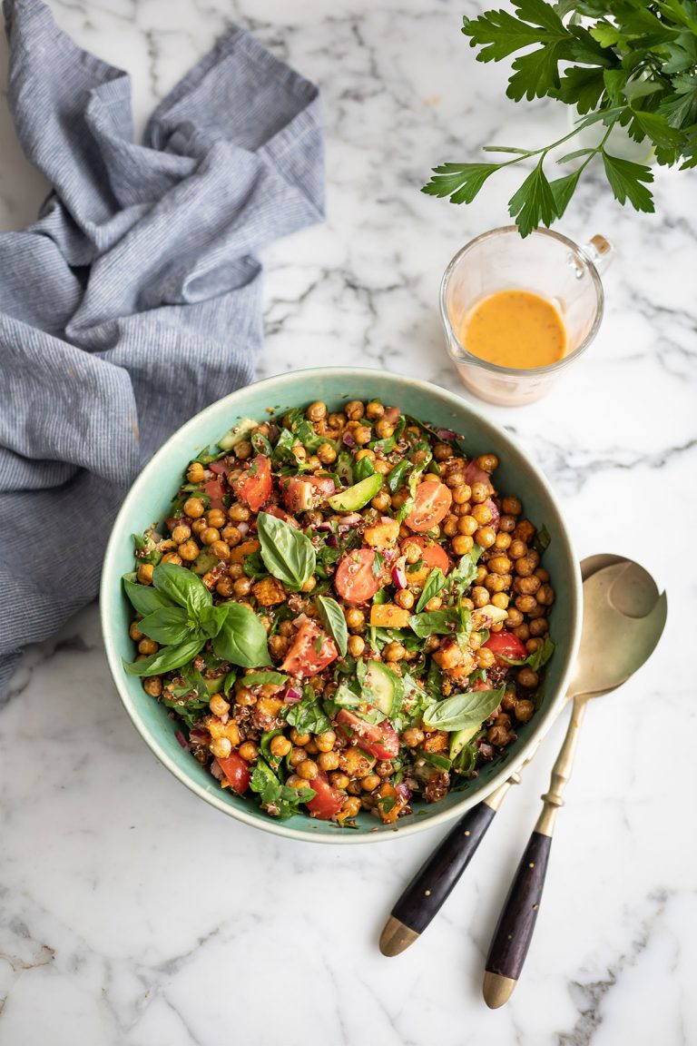 Roast butternut & chickpea salad with quinoa & spinach, cucumber, tomatoes in a basil and tomato vinaigrette dressing