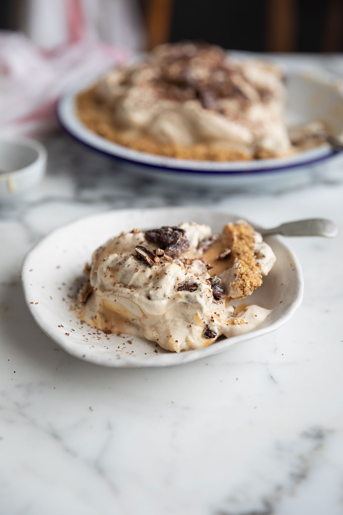 A slice of the best banoffee pie with miso & pecans recipe