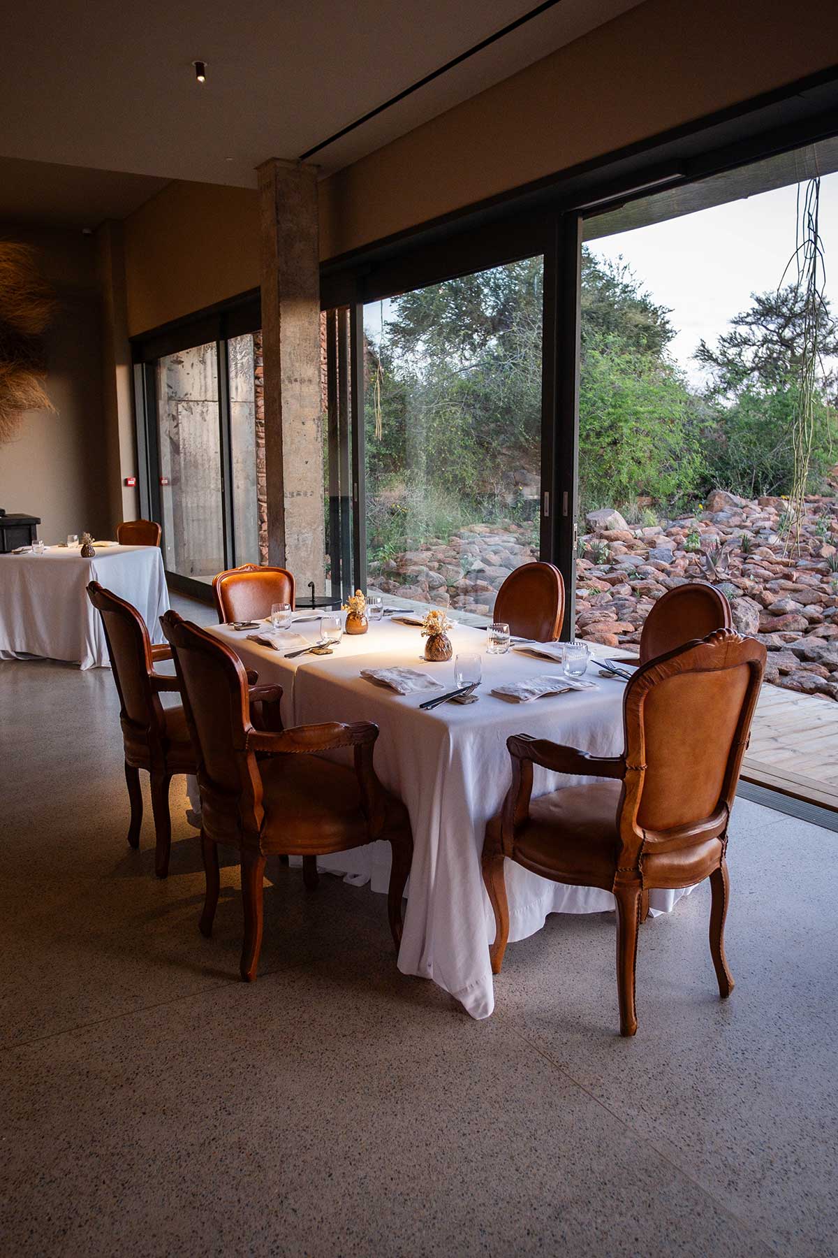 Boscia dining room • Drizzle and Dip A table set at Boscia restaurant at Tswalu