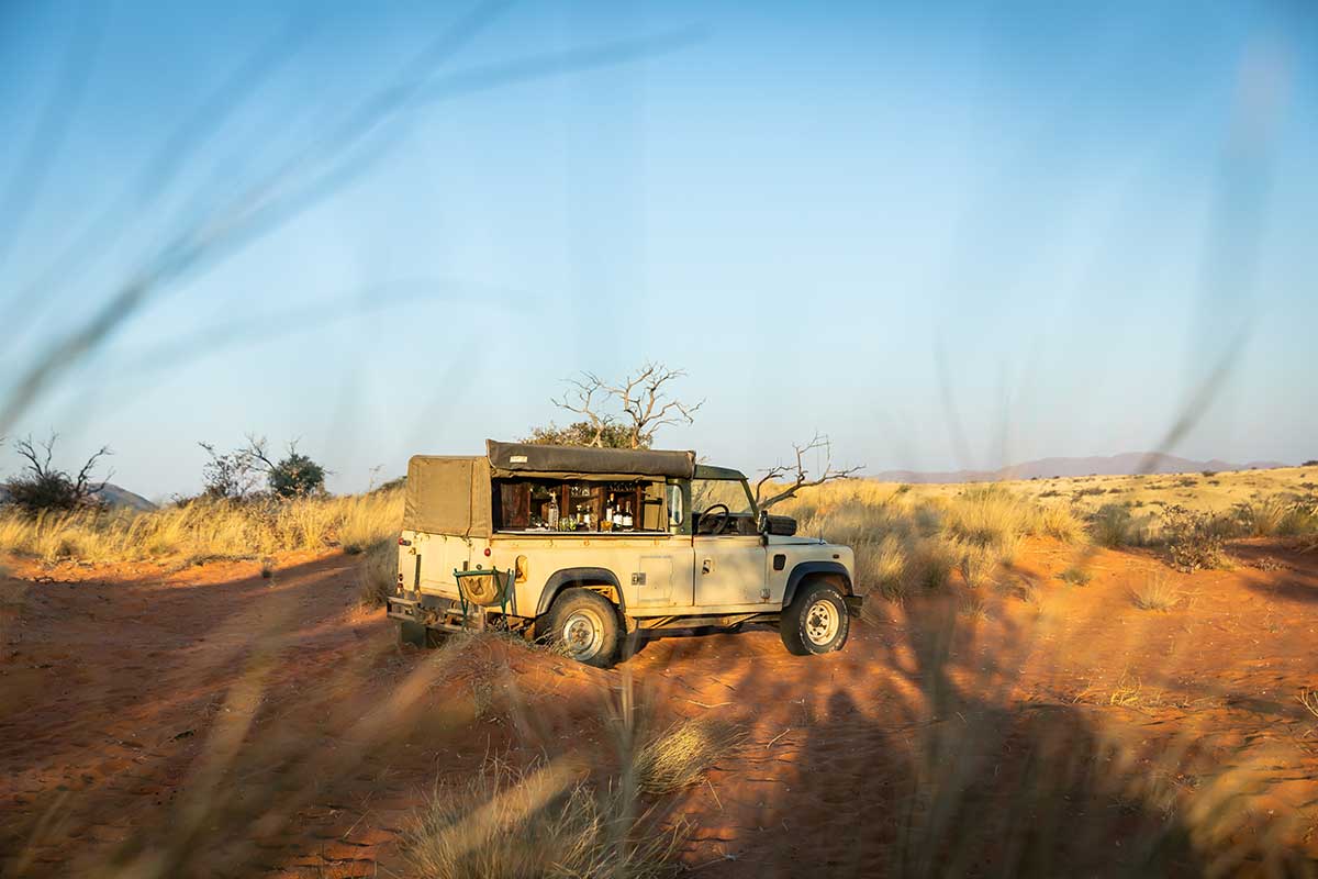 Jeep on dune at Tswalu • Drizzle and Dip Jeep on dune at Tswalu